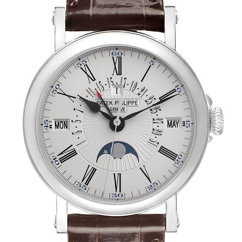 The Patek Philippe Complications watch is shown from the front, featuring a detailed dial with Roman numerals and a brown leather strap.