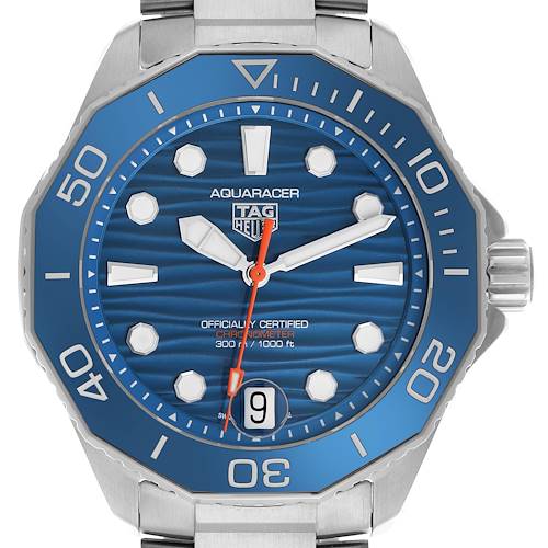 The image shows a front view of the TAG Heuer Aquaracer watch, displaying its blue bezel, dial, and date window.