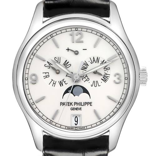 The Patek Philippe Complications watch is shown from the front, displaying its dial, calendar functions, moon phase, and crown.