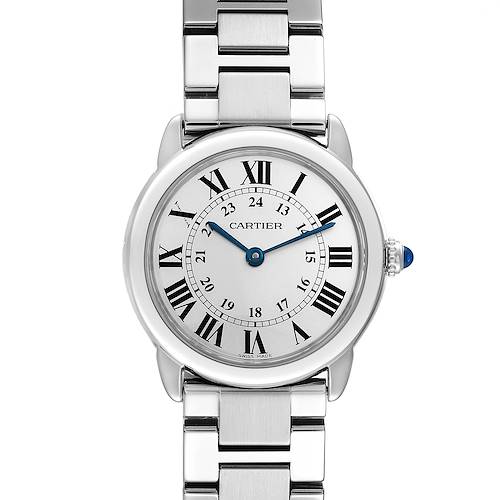 The image shows a frontal view of Cartier's Ronde watch displaying its face, metal band, and blue crown.
