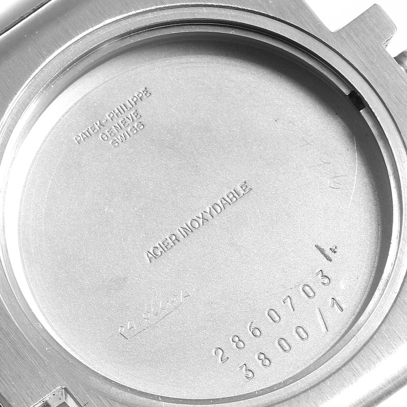 The image shows the inside case back of a Patek Philippe Nautilus watch with model and serial numbers.
