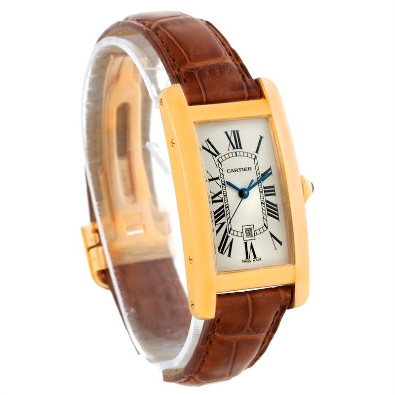 The Cartier Tank Americaine watch is shown at an angled view, highlighting its face, case, and brown leather strap.