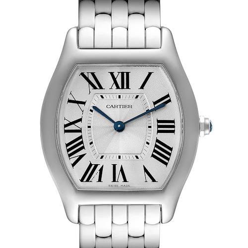 The image shows a close-up of the face and bezel of a Cartier Tortue model watch, displaying its Roman numerals and blue hands.