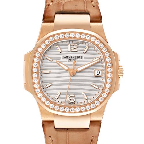 A frontal view of the Patek Philippe Nautilus watch, showing the dial, bezel with diamonds, and part of the strap.