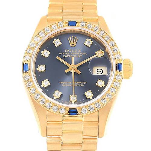 The image shows a frontal view of a Rolex President Datejust, highlighting its gold bracelet, diamond-set bezel, and dark dial with diamonds.