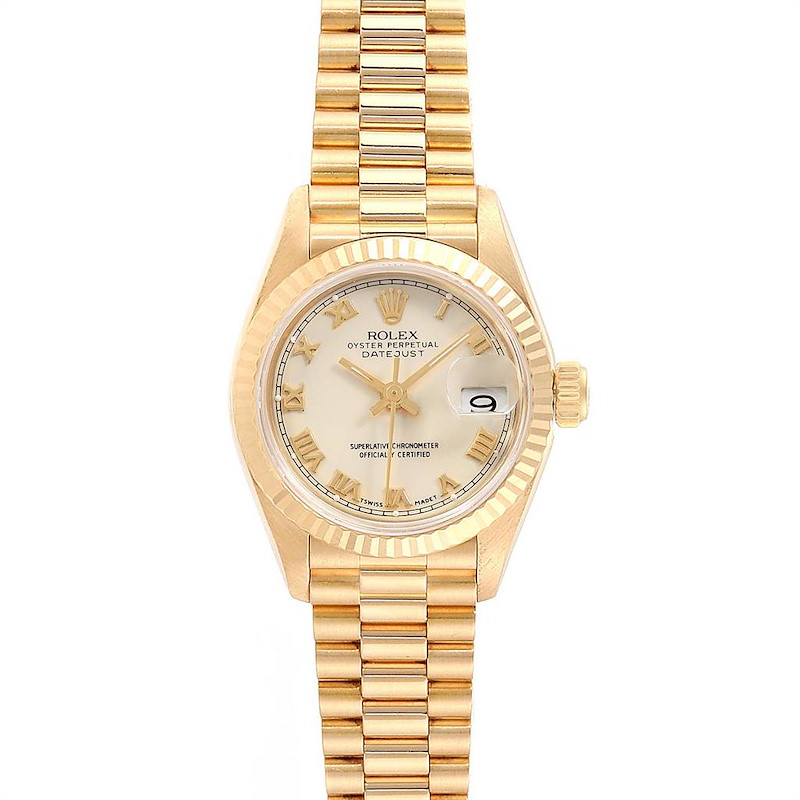 The image shows a front view of a Rolex President model watch, displaying the dial, date window, and bracelet.