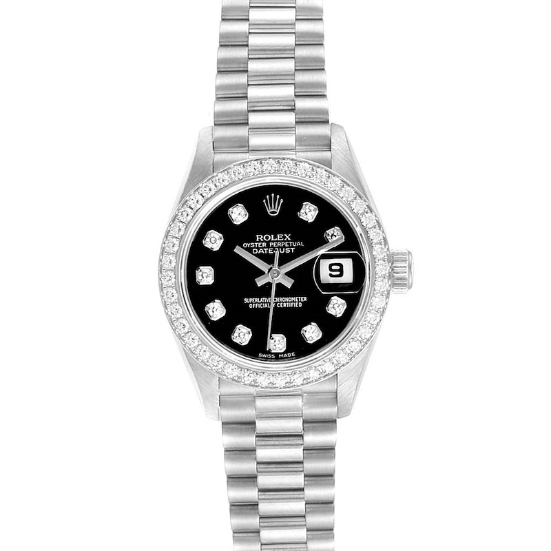 The image shows a front view of the Rolex President model watch, highlighting its black dial, date window, and diamond hour markers.
