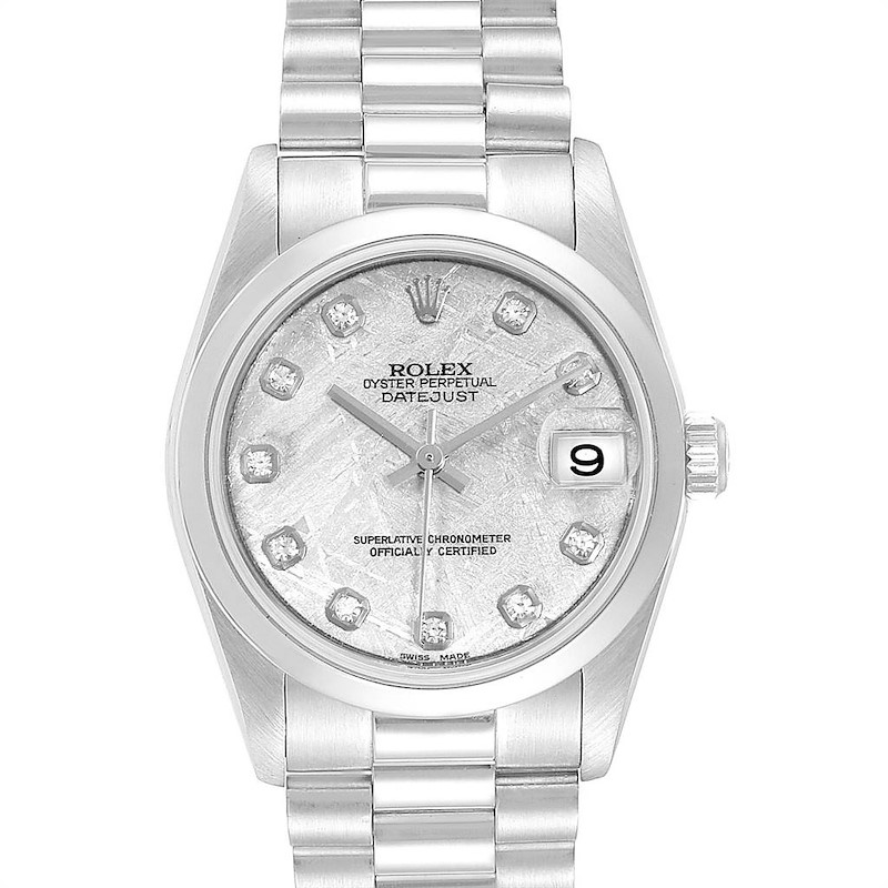 The image shows a front view of the Rolex President model, highlighting the dial, bracelet, and date window.
