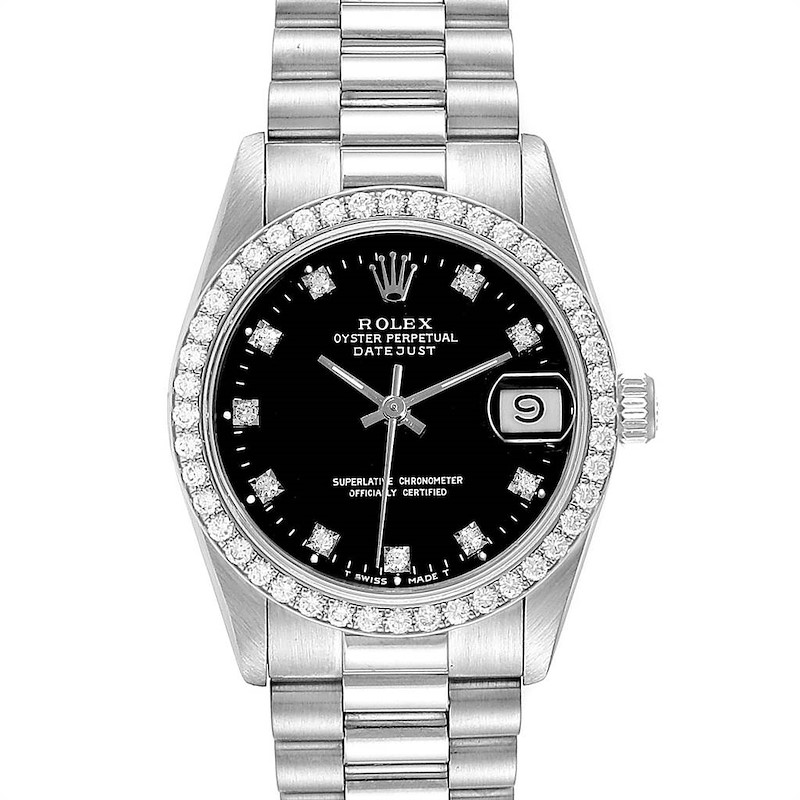 The image shows a front view of a Rolex President model watch, including the black dial, diamond hour markers, date window, and bracelet.