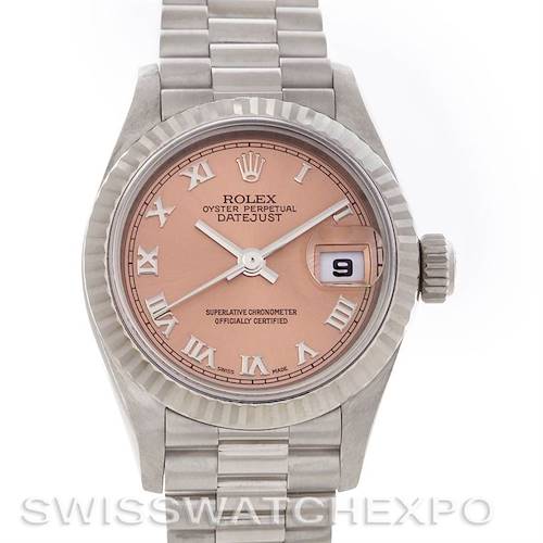 This image shows a Rolex President model watch with a close-up view of its face, including the bezel, dial, crown, and part of the bracelet.