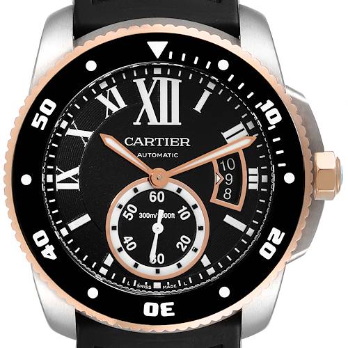 This image shows the face and bezel of the Calibre de Cartier watch by Cartier, highlighting its dial, hands, and date window.