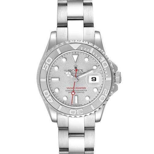 The Rolex Yacht-Master watch is shown from a top-down angle, displaying its face, bezel, and stainless steel bracelet.