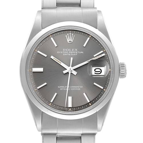 The Rolex Vintage Collection Datejust watch is shown from the front angle, featuring its grey dial, date display, and stainless steel bracelet.