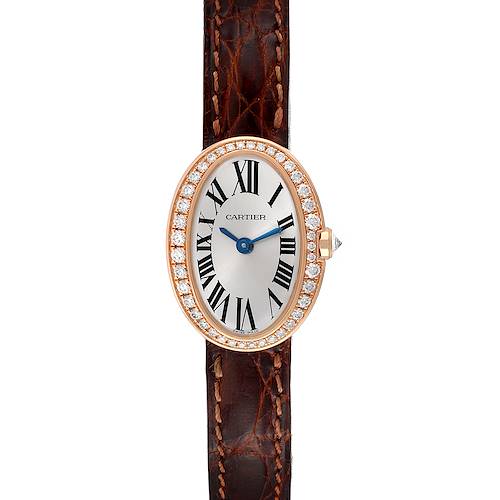 The image shows a Cartier Baignoire watch from a top-down angle, featuring its oval diamond-studded bezel, Roman numeral face, and leather strap.