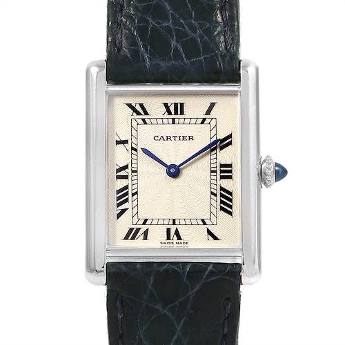 The image shows a front-angle view of the Cartier Tank Classic watch, featuring its face, hands, and part of the leather strap.