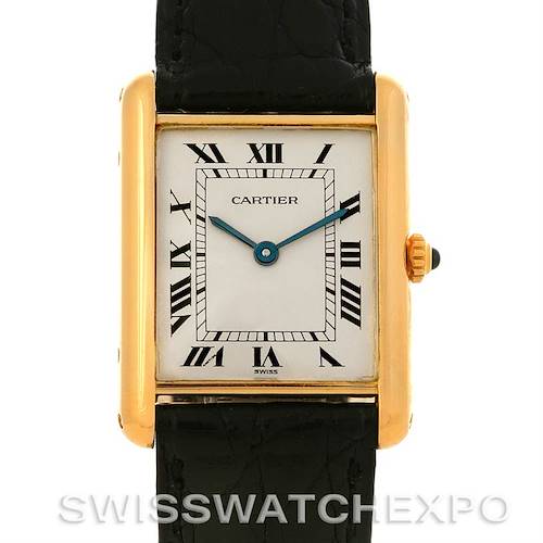 The image shows a front view of a Cartier Tank Classic watch with a leather strap, gold case, and Roman numeral dial.