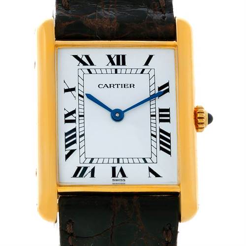 The image shows a frontal view of a Cartier Tank Classic watch, highlighting the dial, case, and part of the leather strap.