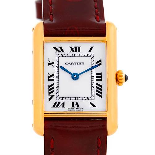 The Cartier Tank Classic watch is shown from a front angle, highlighting the face, case, and part of the strap.