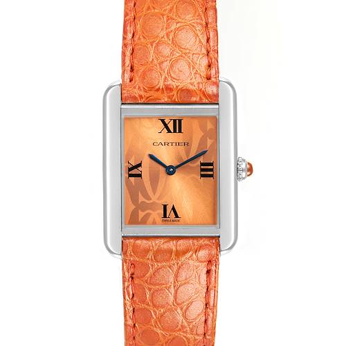 The image shows a Cartier Tank Solo watch from a front angle, highlighting its orange leather strap and rectangular face.