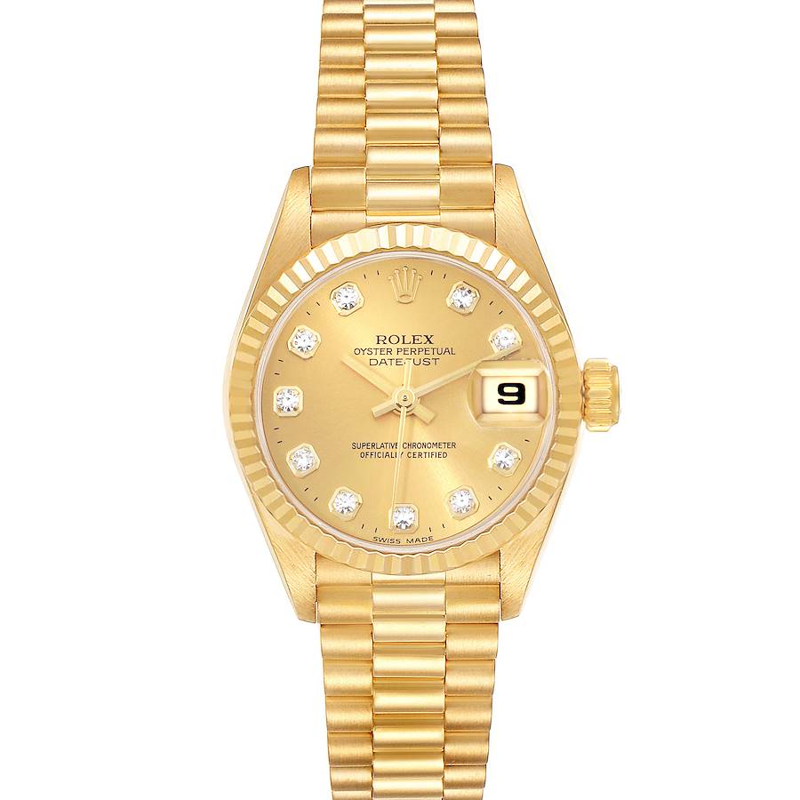 The image shows a Rolex Datejust watch from the front, highlighting its gold dial, diamond hour markers, and gold bracelet.