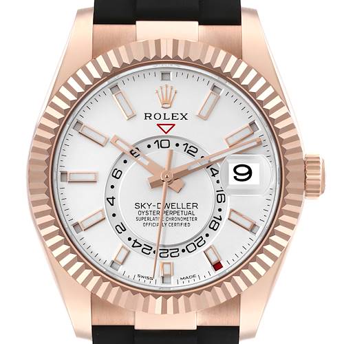 The Rolex Sky-Dweller watch is shown from a front angle, featuring its dial, bezel, crown, and part of the black strap.