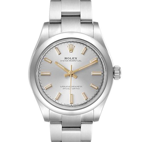 The Mid-Size Rolex watch is shown from a top-down angle, highlighting the dial, hands, crown, and a portion of the bracelet.