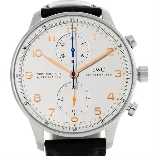 The image shows the front view of an IWC Portuguese Chronograph watch, featuring a white dial, gold numerals, and a black leather strap.
