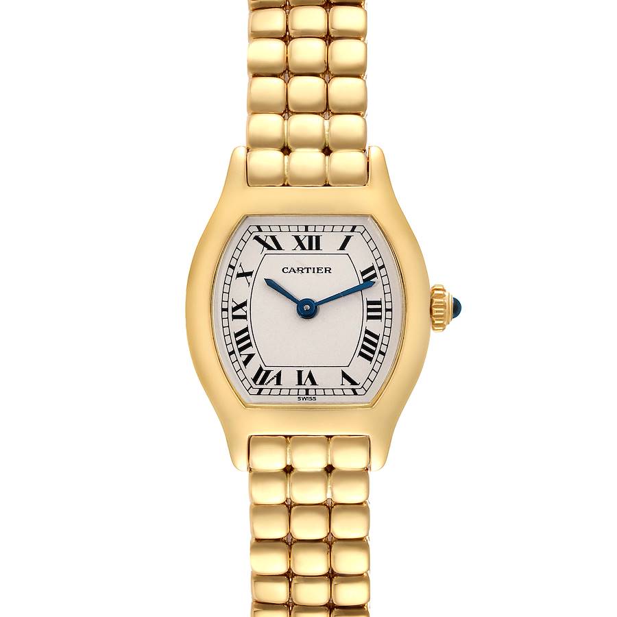 The image shows a Cartier Tortue model watch from a top-down angle, displaying the face, bracelet, and crown.