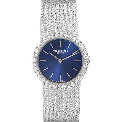 This image shows a front view of the Patek Philippe Calatrava watch, displaying its blue dial, diamond bezel, and woven metal band.