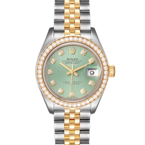 This image shows a frontal view of a Rolex Datejust watch featuring a green dial, diamond bezel, and two-tone bracelet.