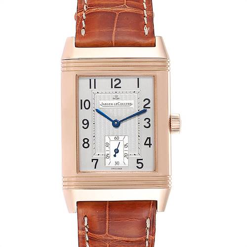 The image shows the front view of a Jaeger-LeCoultre Reverso watch, featuring the rectangular face, numerals, and brown leather strap.