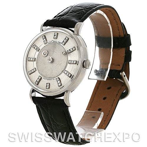 The image shows a Jaeger LeCoultre Vintage model watch at a slight angle, highlighting the dial, bezel, crown, and black leather strap.